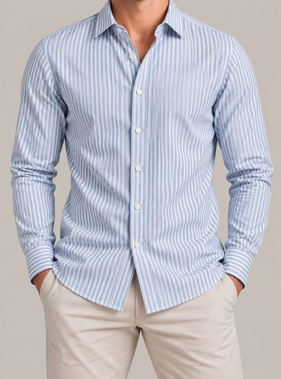 Man wearing a long-sleeved shirt in a blue and white vertical stripe